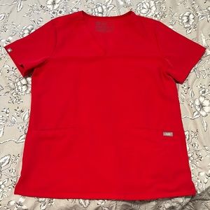 Womens fig scrub top size medium in pop red. Color discontinued.